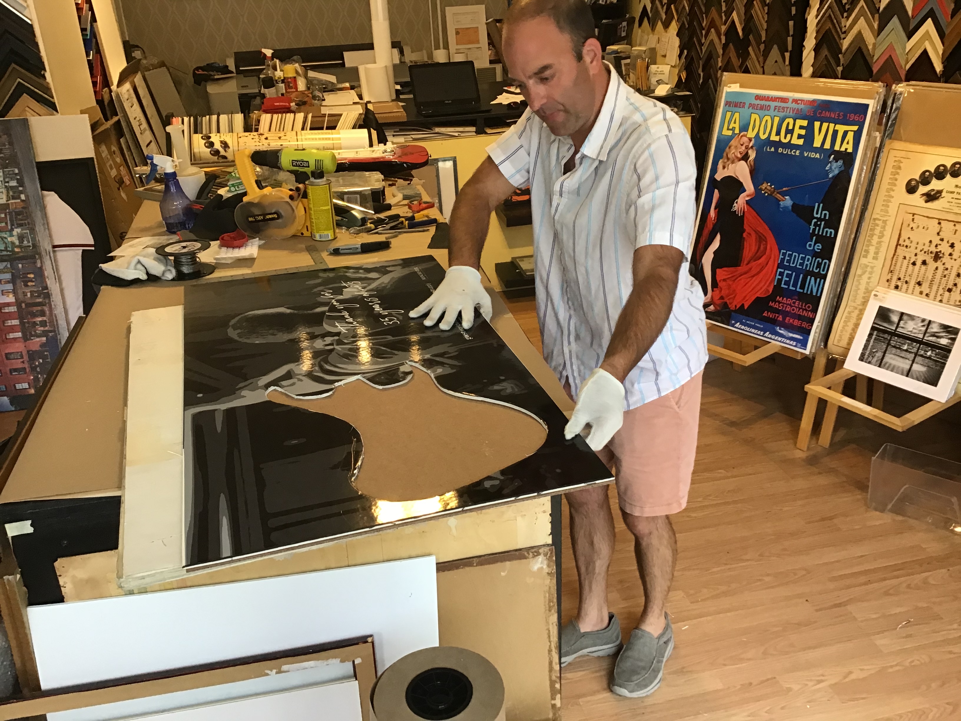 Kory Mitchel Frame Room Owner doing guitar frame project