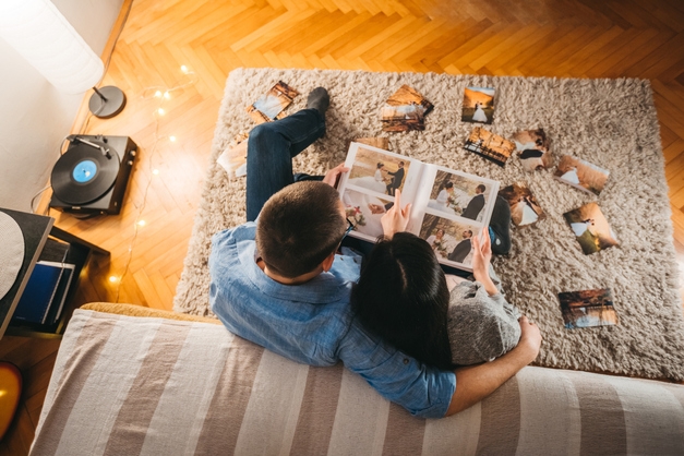 couple looking at their wedding photos